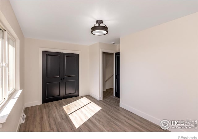 empty room featuring hardwood / wood-style floors