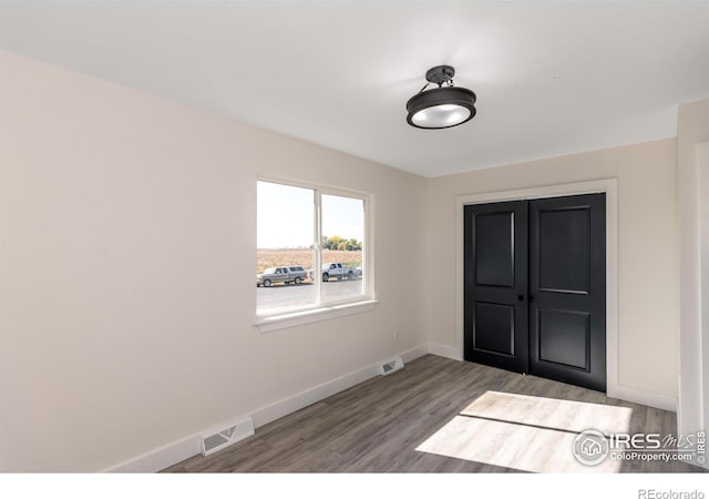 entrance foyer with hardwood / wood-style flooring