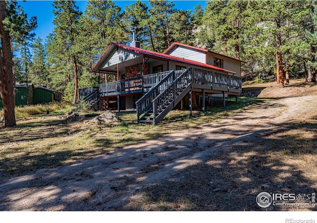 view of front of property featuring a deck