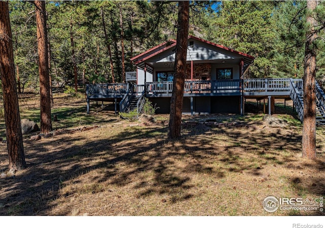 view of front of house featuring a wooden deck