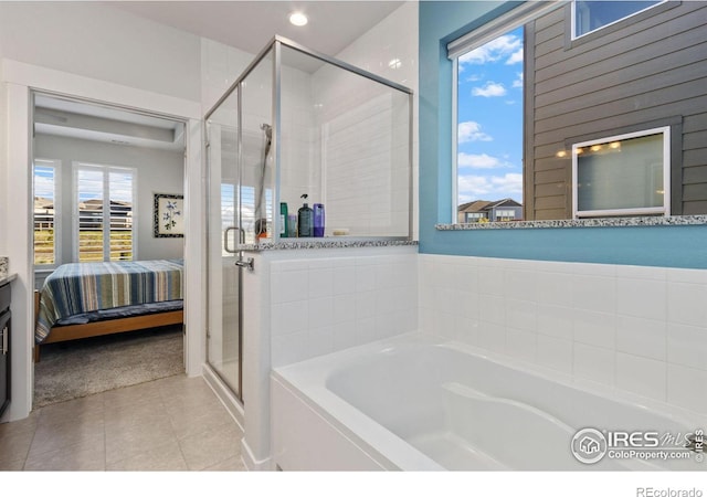 bathroom featuring separate shower and tub and tile patterned flooring