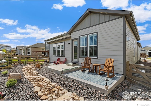 rear view of property featuring a patio area