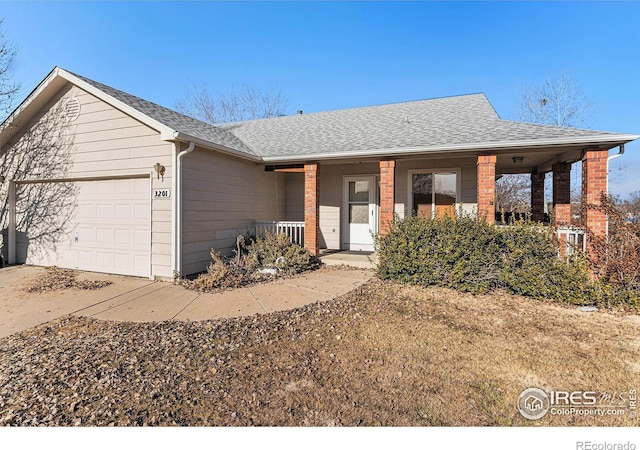 ranch-style house with a garage and covered porch