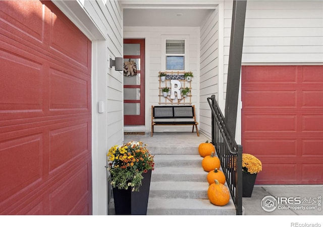 view of exterior entry with covered porch