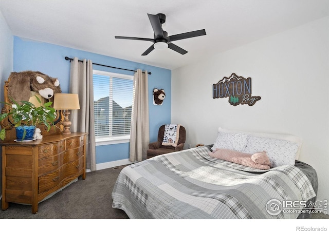 bedroom with dark colored carpet and ceiling fan