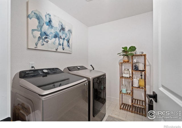 clothes washing area featuring independent washer and dryer