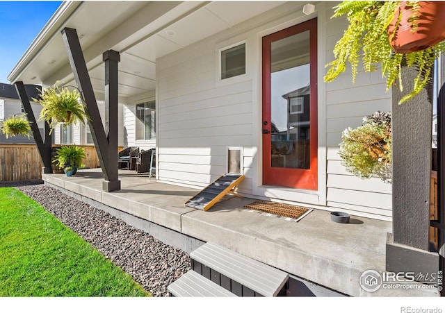 property entrance featuring covered porch