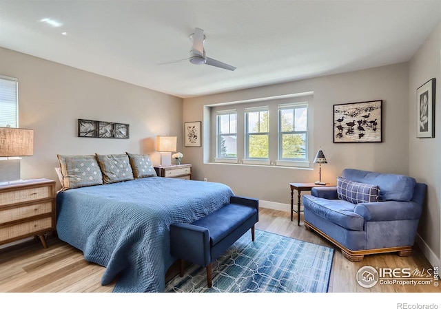 bedroom featuring wood-type flooring and ceiling fan