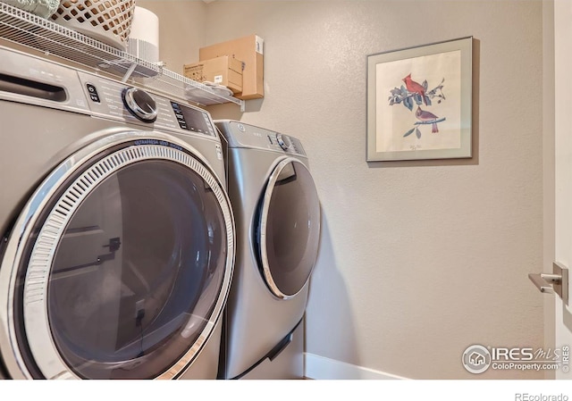 washroom featuring washer and dryer