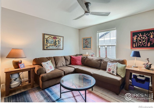 living room with ceiling fan and wood-type flooring