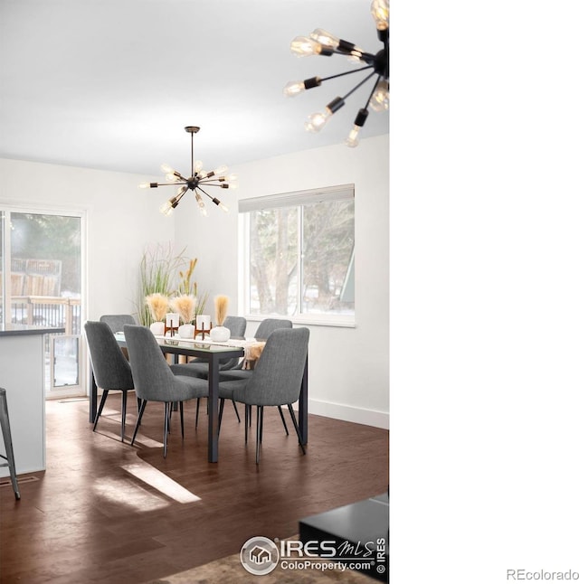 dining area with an inviting chandelier and dark hardwood / wood-style floors