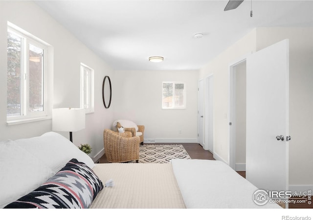 bedroom with hardwood / wood-style flooring and ceiling fan