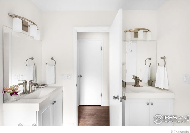 bathroom featuring hardwood / wood-style flooring and vanity