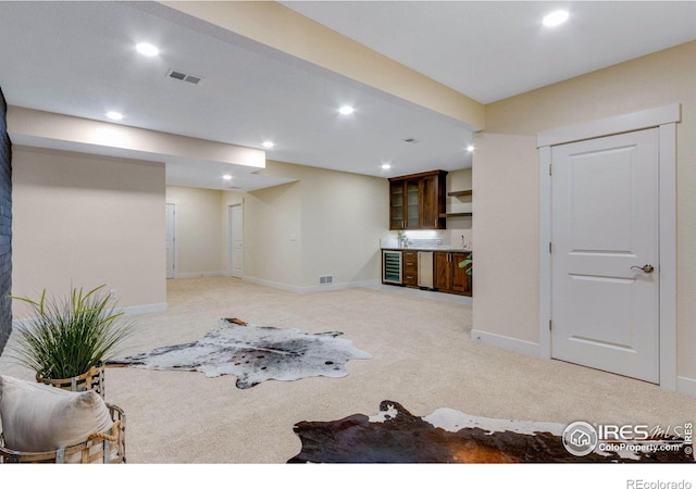 living room featuring light colored carpet and beverage cooler