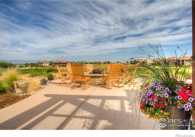 view of patio with a fire pit