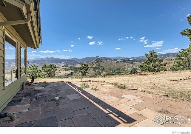 view of patio / terrace with a mountain view