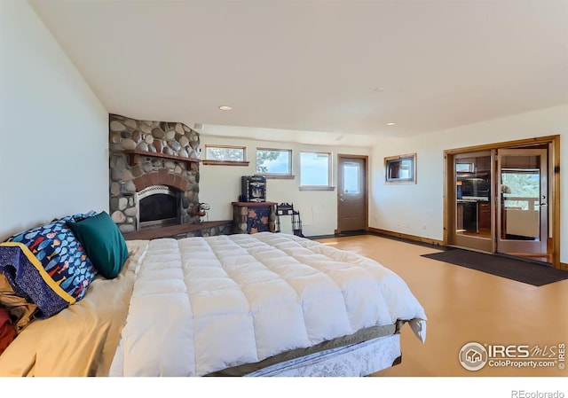 bedroom featuring a fireplace