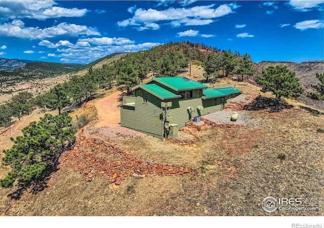 birds eye view of property with a mountain view