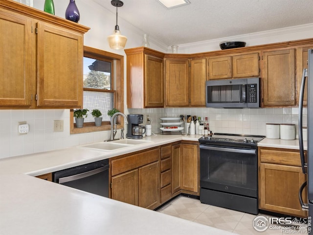 kitchen with sink, pendant lighting, dishwashing machine, electric stove, and backsplash