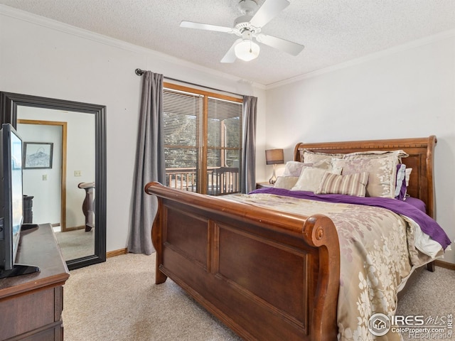 carpeted bedroom featuring ceiling fan, ornamental molding, a textured ceiling, and access to exterior