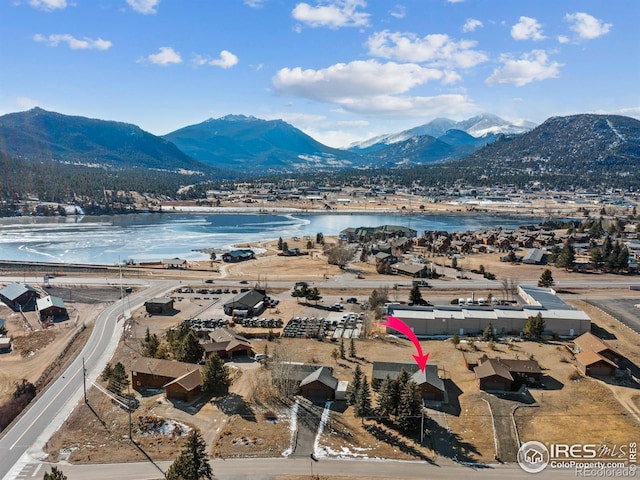 aerial view with a water and mountain view