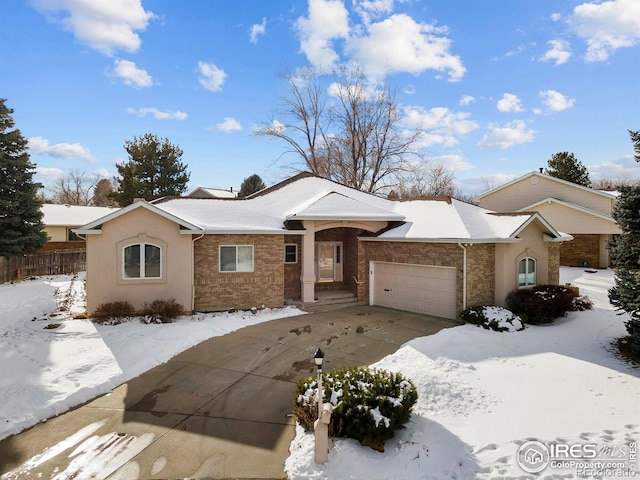 single story home featuring a garage