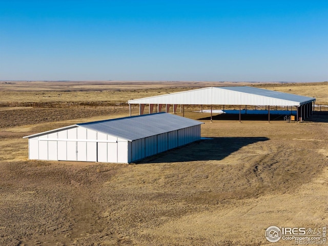 view of outdoor structure featuring a rural view