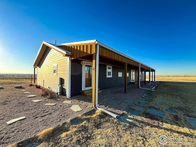 view of home's exterior with a rural view