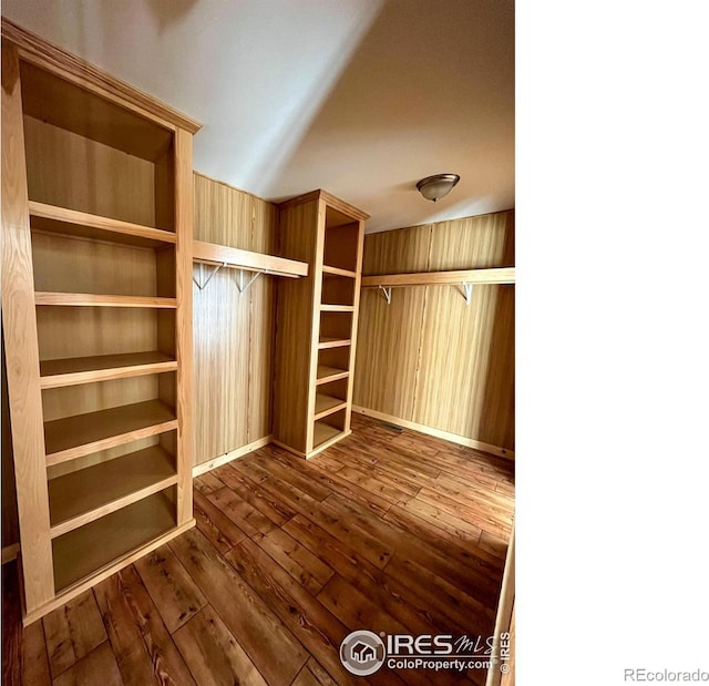 walk in closet featuring wood-type flooring