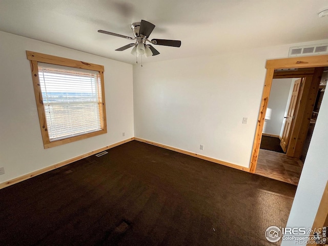 carpeted empty room with ceiling fan