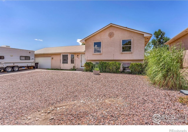 split level home featuring a garage