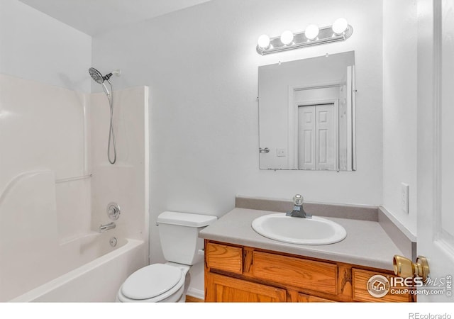 full bathroom featuring vanity, shower / washtub combination, and toilet