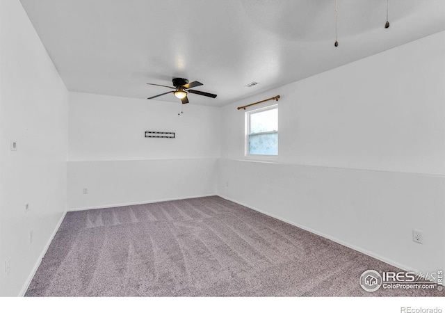 unfurnished room with carpet and ceiling fan