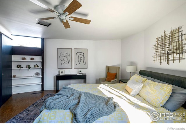 bedroom with ceiling fan and wood-type flooring