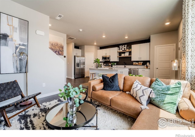 living room featuring dark hardwood / wood-style flooring