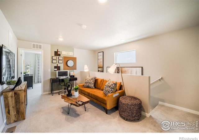 living room with light colored carpet