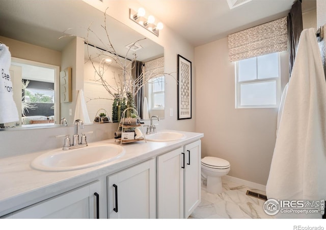 bathroom with vanity and toilet