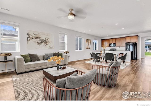 6508 Copper Dr, Frederick, CO 80516 - living area featuring a ceiling fan, light wood-style flooring, recessed lighting, and baseboards
