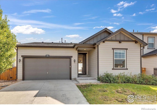 6508 Copper Dr, Frederick, CO 80516 - ranch-style house featuring board and batten siding, driveway, a garage, and fence