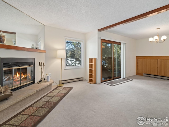 carpeted living room featuring a baseboard radiator, a textured ceiling, and an inviting chandelier