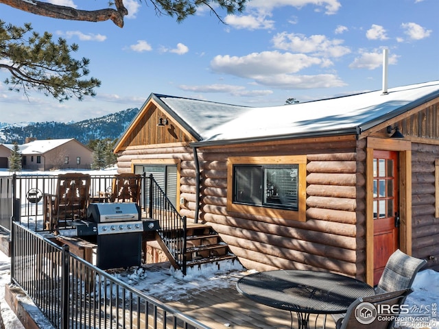 exterior space with a deck with mountain view