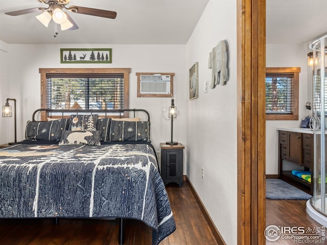 bedroom featuring dark hardwood / wood-style floors, a wall mounted AC, and ceiling fan