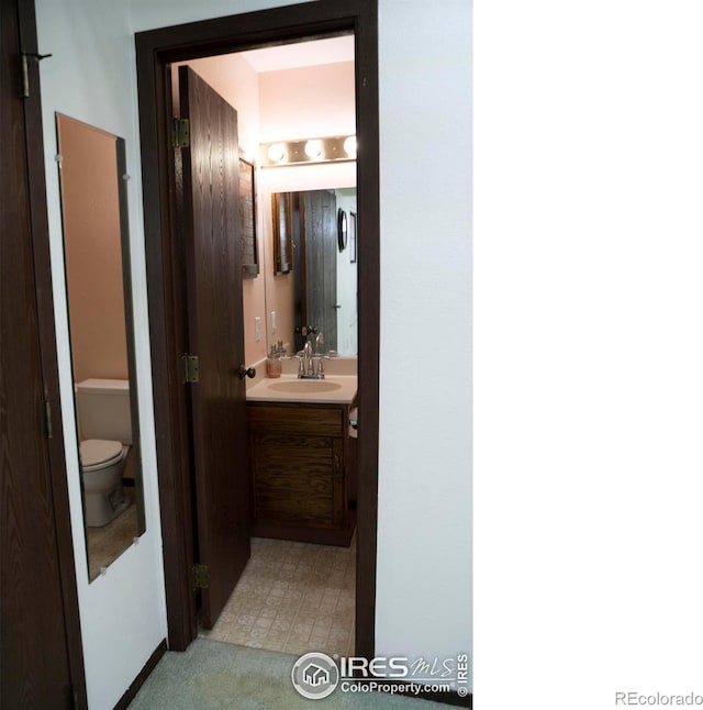 bathroom with vanity and toilet