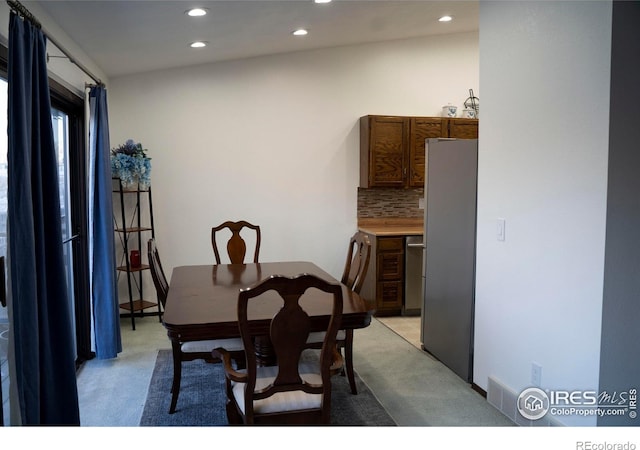 view of carpeted dining space