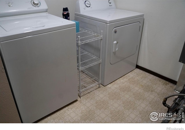 laundry room with independent washer and dryer