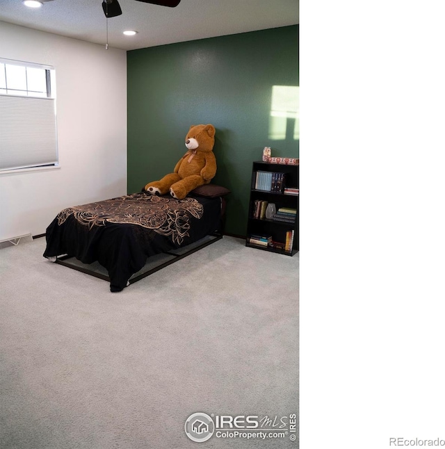 carpeted bedroom with ceiling fan