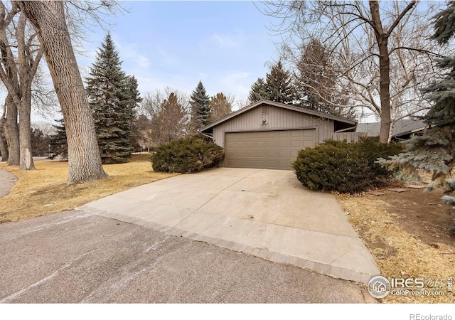 view of side of home featuring a garage