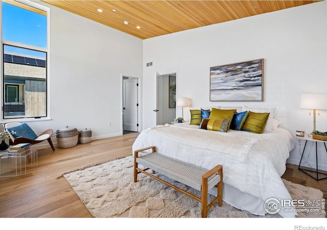 2125 Vine Ave, Boulder, CO 80304 - bedroom with wood finished floors, baseboards, recessed lighting, a high ceiling, and wood ceiling