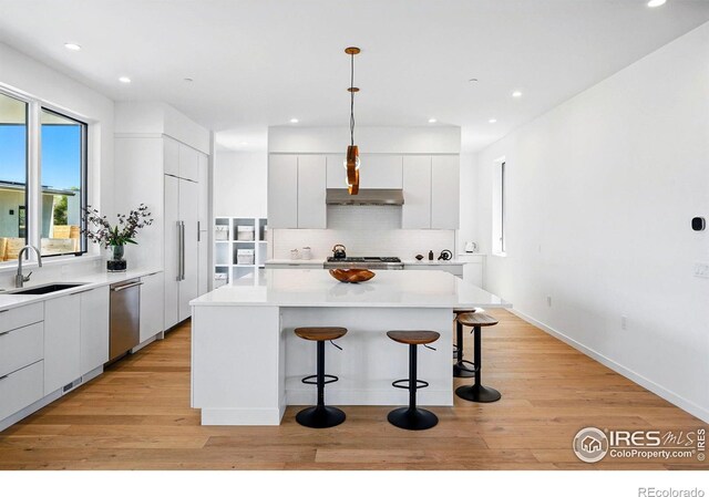 2125 Vine Ave, Boulder, CO 80304 - kitchen with a sink, modern cabinets, dishwasher, a kitchen bar, and backsplash