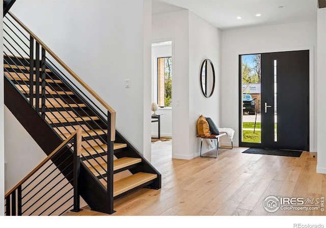 2125 Vine Ave, Boulder, CO 80304 - entryway featuring healthy amount of natural light, wood-type flooring, stairway, and recessed lighting